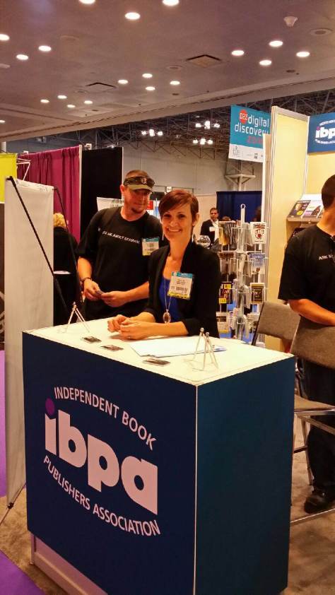Me at the IBPA booth, and that's one of my team members behind me.